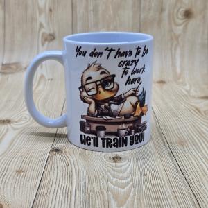 Mok – Grappige Quote – “You Don’t Have to Be Crazy to Work Here”